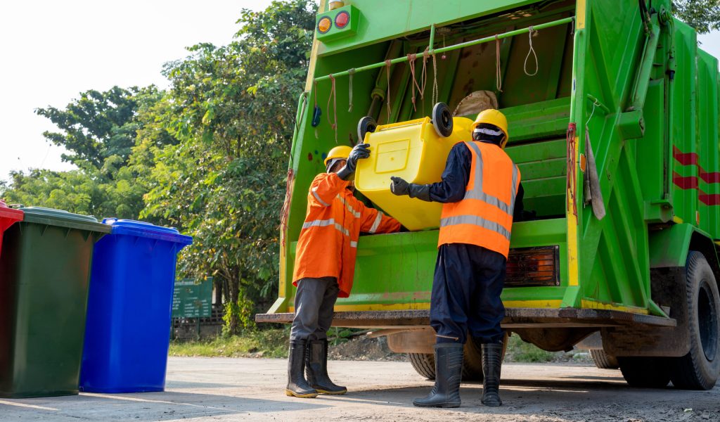 Workers collect garbage with Garbage collection truck,Concept of cleanliness and prevention of germs.